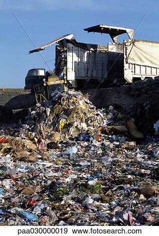 Truck dumping trash in landfill. View Large Photo Image Stock Photo - Truck dumping trash in landfill.. Fotosearch