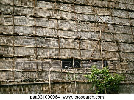 Bamboo wall, man standing by window View Large Photo Image Picture - Bamboo wall, man standing by window. Fotosearch