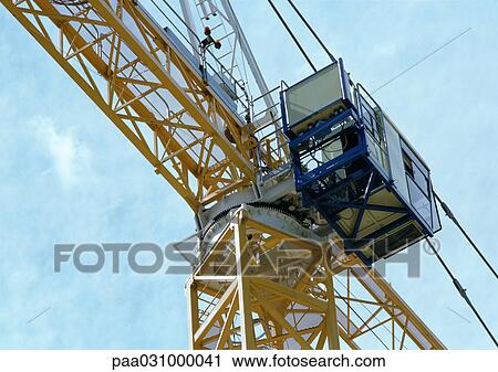 Stock Image - Crane cab, low angle view. Fotosearch