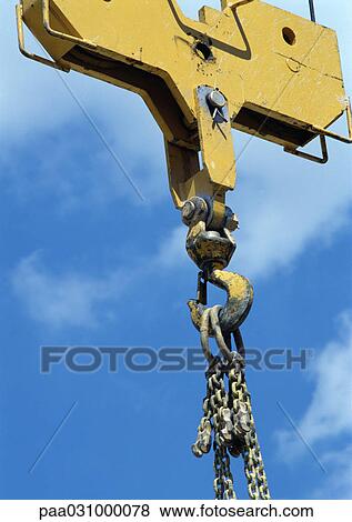 Stock Photo - Crane hook, close-up, sky in background. Fotosearch