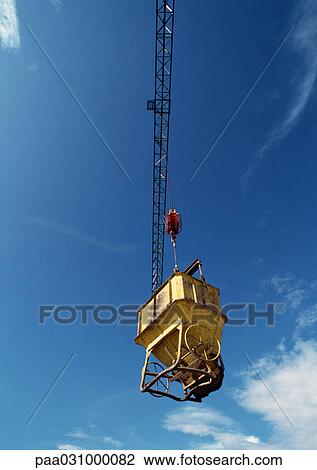 Crane lifting cement mixer, sky in background View Large Photo Image Stock Image - Crane lifting cement mixer, sky in background. Fotosearch