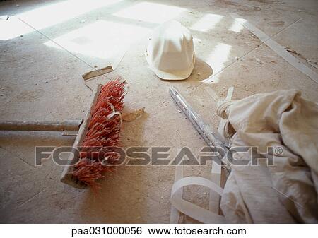 Hard hat and broom on floor View Large Photo Image Stock Photograph - Hard hat and broom on floor. Fotosearch