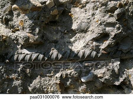 Stock Photograph - Metal rod in ground, close-up. Fotosearch