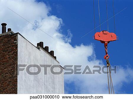 Part of crane near building View Large Photo Image Stock Image - Part of crane near building. Fotosearch
