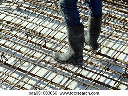 Person standing on steel framing, low section View Large Photo Image Stock Image - Person standing on steel framing, low section. Fotosearch