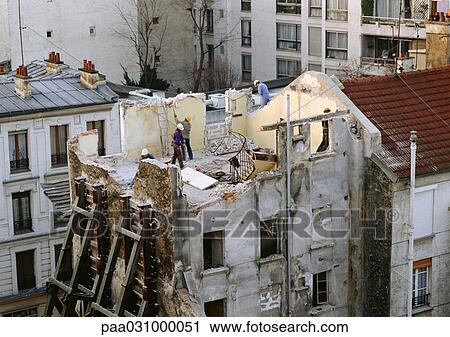Workers on top of old building with no roof View Large Photo Image Stock Image - Workers on top of old building with no roof. Fotosearch
