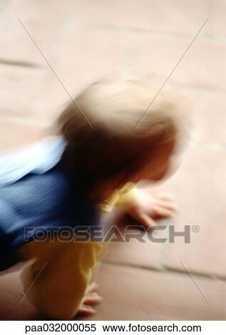 Stock Photography - Baby on all fours, blurred. Fotosearch