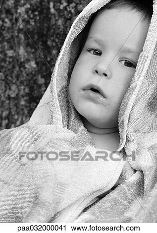 Stock Image - Child in bath towel, close-up, b&w. Fotosearch