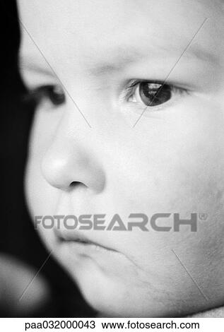 Stock Image - Child's face, close-up, b&w. Fotosearch