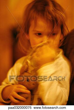 Girl hugging stuffed rabbit, portrait, blurred View Large Photo Image Stock Photography - Girl hugging stuffed rabbit, portrait, blurred. Fotosearch