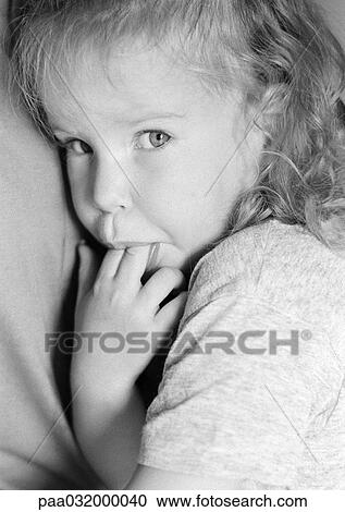 Girl with fingers in mouth, portrait, b&w View Large Photo Image Stock Image - Girl with fingers in mouth, portrait, b&w. Fotosearch