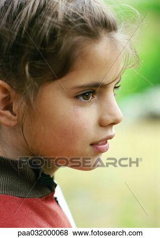 Girl's face, close-up, side view View Large Photo Image Stock Photo - Girl's face, close-up, side view. Fotosearch