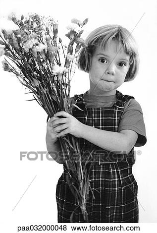 Stock Photo - Little girl holding bouquet, b&w. Fotosearch
