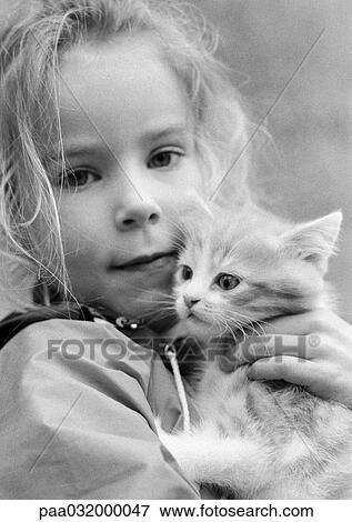 Little holding kitten, portrait, b&w View Large Photo Image Stock Photo - Little holding kitten, portrait, b&w. Fotosearch