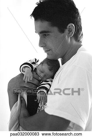 Man hugging baby, side view, b&w View Large Photo Image Stock Image - Man hugging baby, side view, b&w. Fotosearch