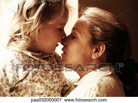 Mature woman hugging girl, side view View Large Photo Image Stock Photo - Mature woman hugging girl, side view. Fotosearch