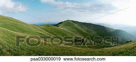 France, grassy plateau, moutain ridge in background, panoramic view View Large Photo Image Stock Photo - France, grassy plateau, moutain ridge in background, panoramic view. Fotosearch