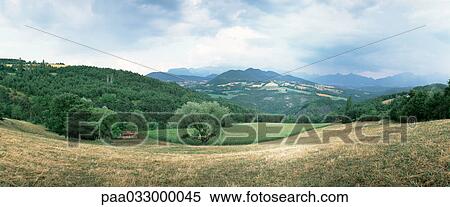 Stock Photography - Hillside, mountains in background, panoramic view. Fotosearch