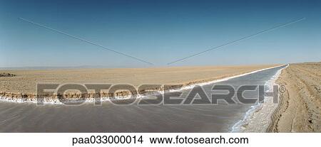 Picture - Tunisia, canal in desert landscape, panoramic view. Fotosearch