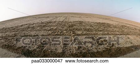 Tunisia, tire tracks in desert, panoramic view View Large Photo Image Stock Photo - Tunisia, tire tracks in desert, panoramic view. Fotosearch