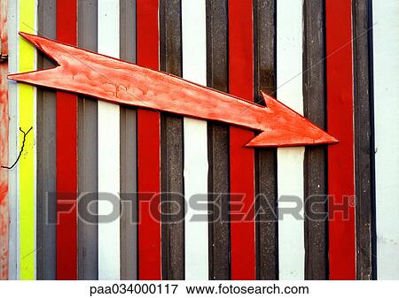 Stock Illustration - Arrow sign on striped background, close-up. Fotosearch