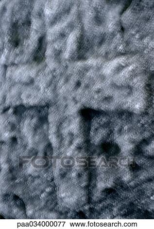 Stock Illustration - Cross engraved in rock, blurred, close-up. Fotosearch
