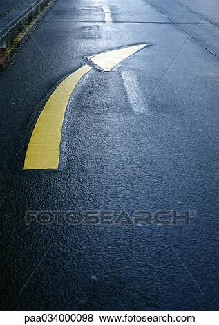 Directional arrow on road, close-up View Large Illustration Stock Illustration - Directional arrow on road, close-up. Fotosearch