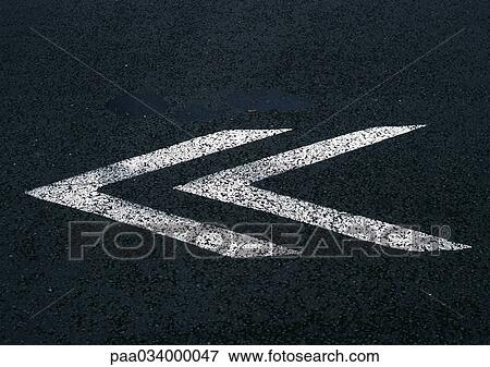 Stock Illustration - Directional signs on road, close-up. Fotosearch