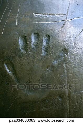 Drawing - Impression of hand print, close-up. Fotosearch