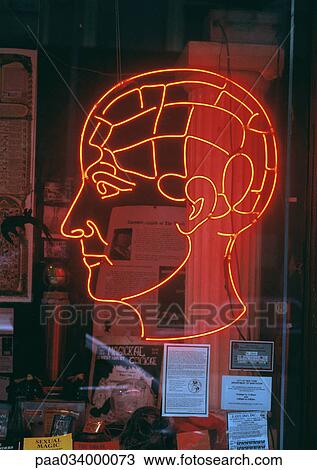 Drawing - Neon head sign on store window. Fotosearch
