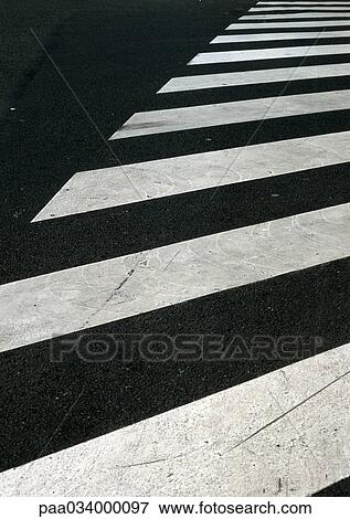Stock Illustration - Pedestrian crossing lines on road, close-up. Fotosearch