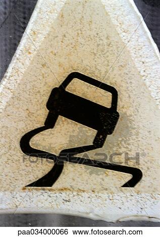 Stock Illustration - Slippery road sign, close-up. Fotosearch