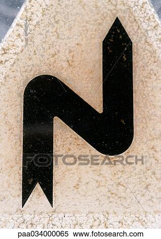 Stock Illustration - Turn in road sign, close-up. Fotosearch