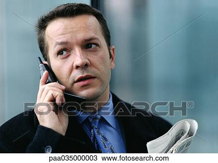 Businessman using cell phone View Large Photo Image Stock Image - Businessman using cell phone. Fotosearch