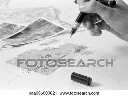 Hand holding pens above drawing, close-up, b&w View Large Photo Image Stock Image - Hand holding pens above drawing, close-up, b&w. Fotosearch