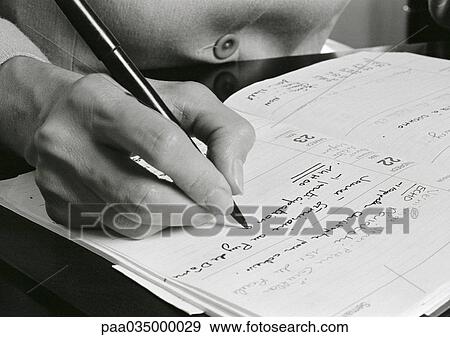 Hand writing on agenda, close-up, b&w View Large Photo Image Stock Photo - Hand writing on agenda, close-up, b&w. Fotosearch