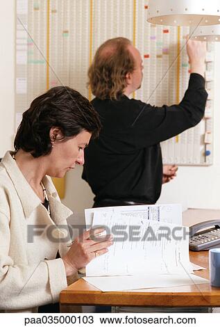 Man and woman in office View Large Photo Image Stock Image - Man and woman in office. Fotosearch