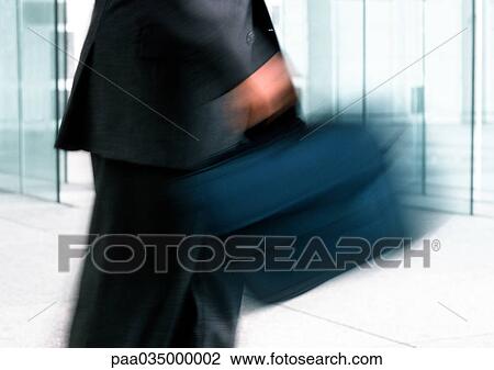 Man holding bag, mid section, blurred motion View Large Photo Image Stock Image - Man holding bag, mid section, blurred motion. Fotosearch
