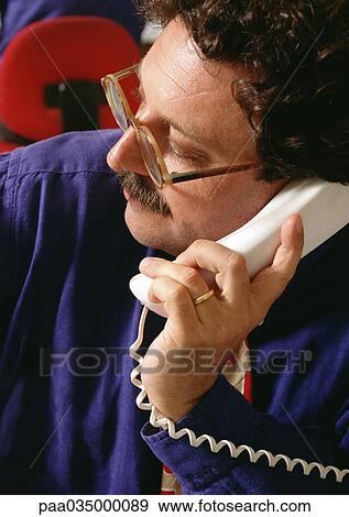 Man using phone, high angle view View Large Photo Image Stock Photo - Man using phone, high angle view. Fotosearch