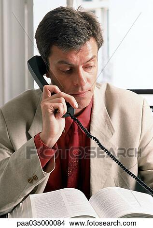 Man using phone, portrait View Large Photo Image Picture - Man using phone, portrait. Fotosearch