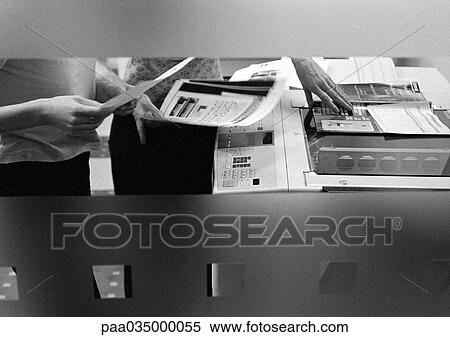 People using photocopier, mid section, b&w View Large Photo Image Stock Photography - People using photocopier, mid section, b&w. Fotosearch