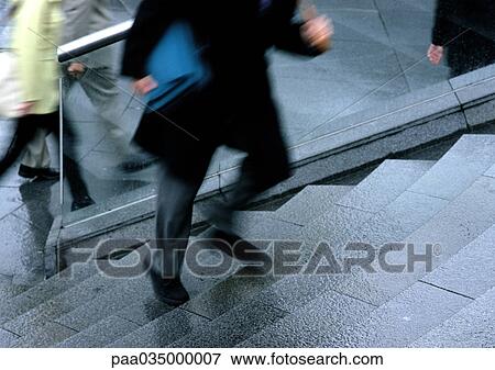 Person climbing stairs, low section, blurred motion View Large Photo Image Stock Photo - Person climbing stairs, low section, blurred motion. Fotosearch