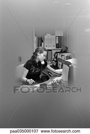 Stock Photo - Woman telephoning, blurred, b&w. Fotosearch
