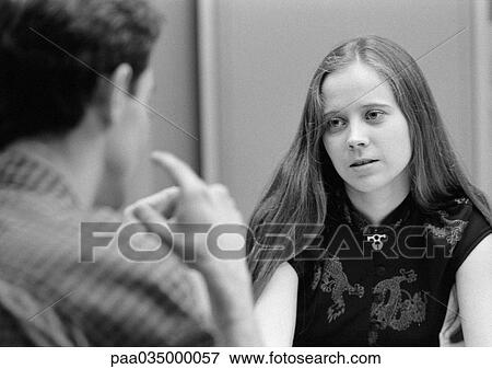 Young man, rear view, and young woman, front view, in focus, b&w View Large Photo Image Stock Photo - Young man, rear view, and young woman, front view, in focus, b&w. Fotosearch