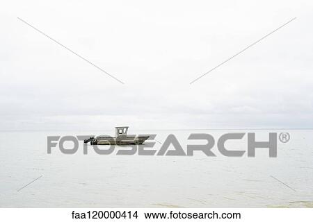 Boat moored in sea View Large Photo Image Picture - Boat moored in sea. Fotosearch