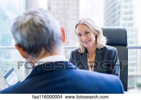 Business people discussing in office View Large Photo Image Picture - Business people discussing in office. Fotosearch