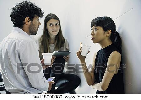 Business people discussing in office View Large Photo Image Stock Image - Business people discussing in office. Fotosearch