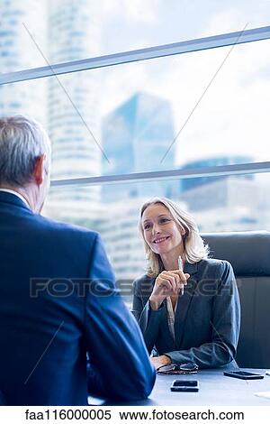 Business people discussing in office View Large Photo Image Stock Photography - Business people discussing in office. Fotosearch