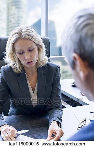 Business people discussing in office View Large Photo Image Stock Photography - Business people discussing in office. Fotosearch