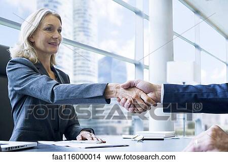 Business people shaking hands View Large Photo Image Picture - Business people shaking hands. Fotosearch